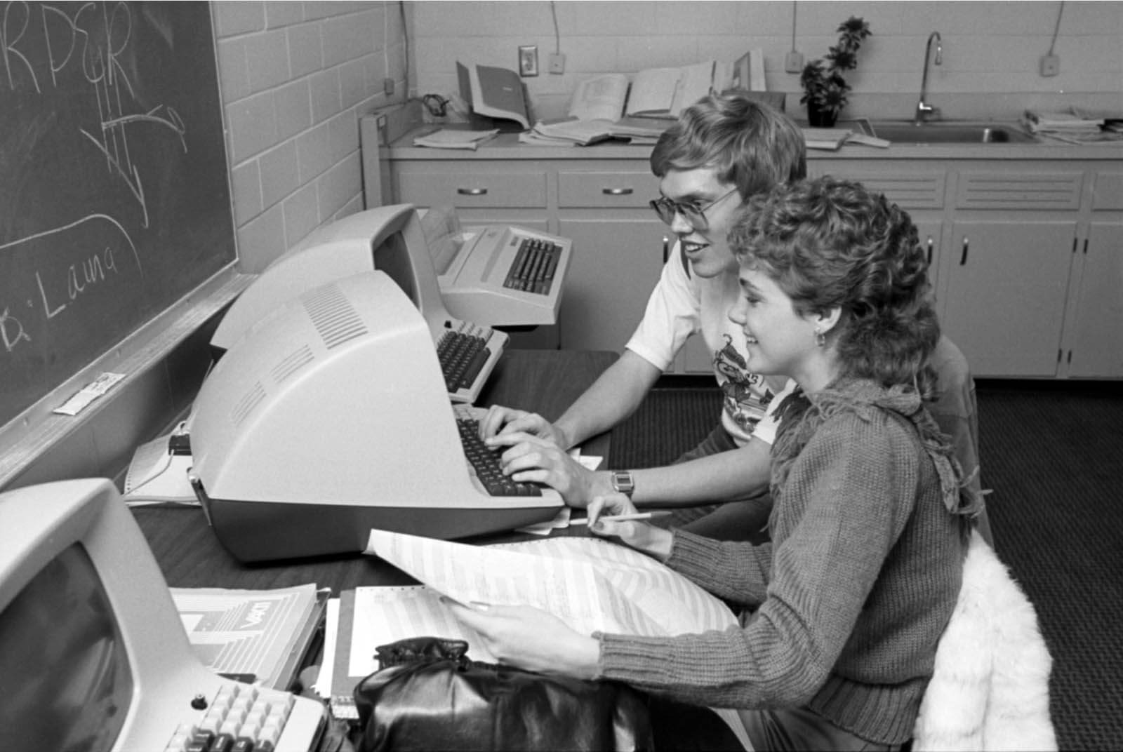 vitange photo of two students working at a computer