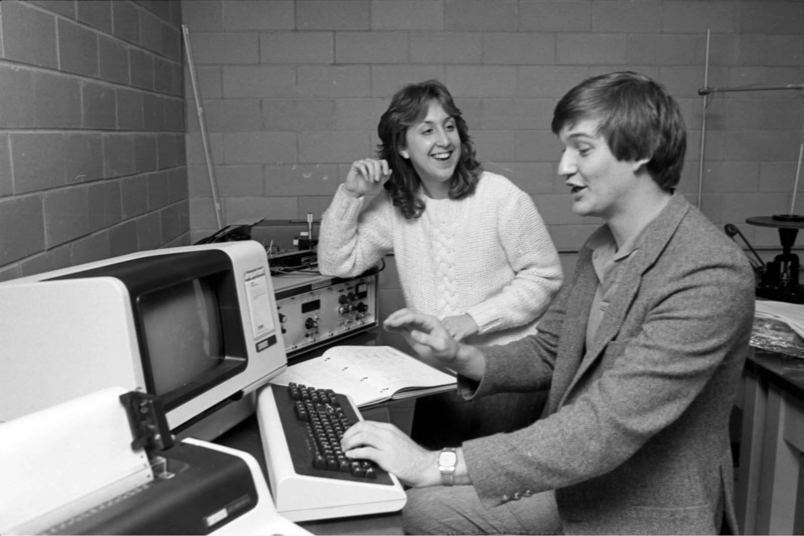 vitange photo of two students working at a computer