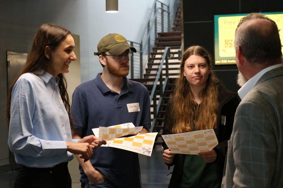 Students and faculty visit at Innovation 2 Impact.